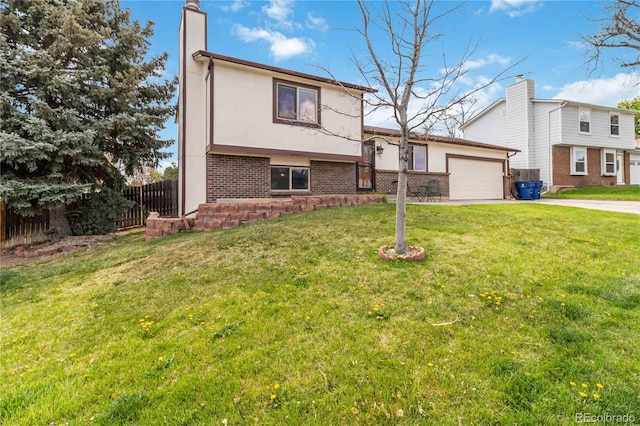10550 Routt St, Westminster, CO 80021 - split level home featuring a garage, fence, a chimney, brick siding, and concrete driveway