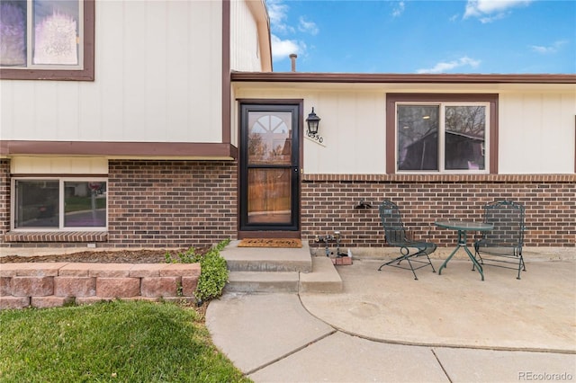 10550 Routt St, Westminster, CO 80021 - doorway to property featuring brick siding