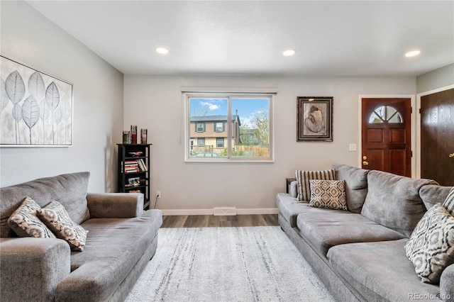 10550 Routt St, Westminster, CO 80021 - living area with recessed lighting, dark wood-style floors, and visible vents