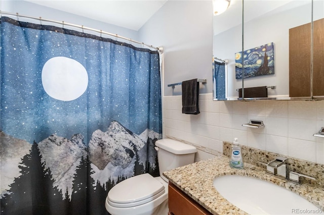 10550 Routt St, Westminster, CO 80021 - full bath featuring vanity, curtained shower, toilet, and tile walls