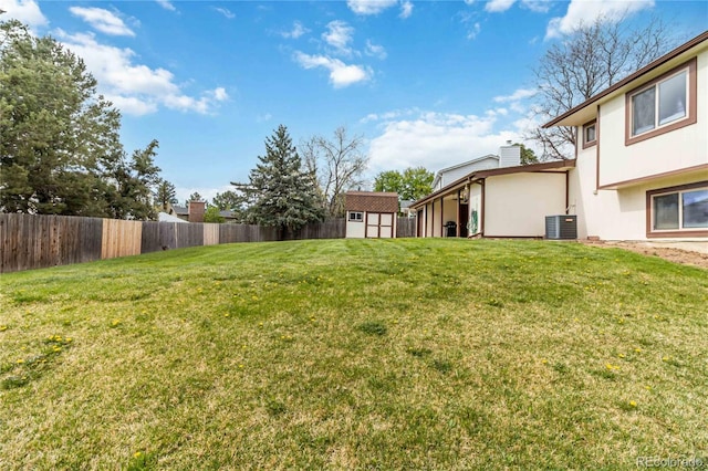 10550 Routt St, Westminster, CO 80021 - view of yard with an outdoor structure, central AC, fence, and a storage shed