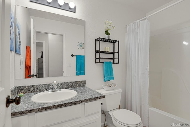 bathroom featuring toilet, vanity, and shower / tub combo with curtain