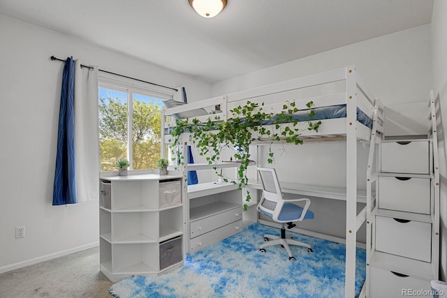 bedroom featuring baseboards and carpet floors