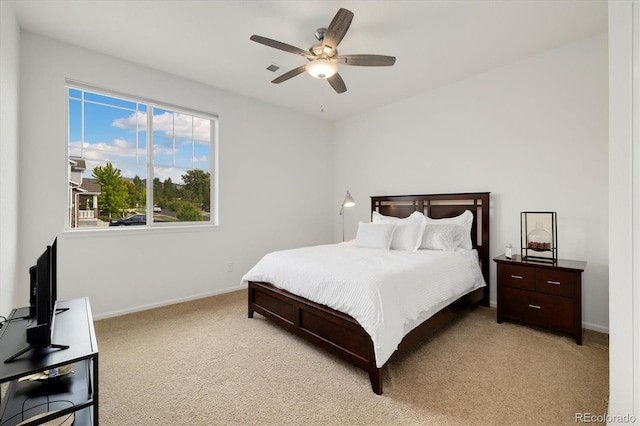 6692 S Robertsdale Way, Aurora, CO 80016 - bedroom with light carpet and a ceiling fan