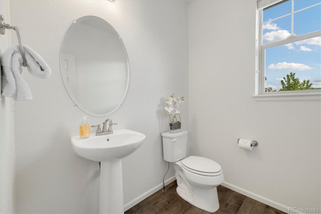 6692 S Robertsdale Way, Aurora, CO 80016 - bathroom featuring wood finished floors and toilet