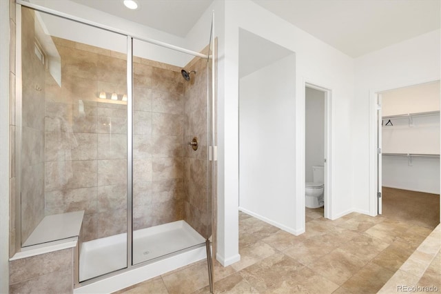 6692 S Robertsdale Way, Aurora, CO 80016 - full bath featuring a shower stall and a walk in closet