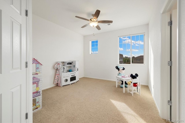 6692 S Robertsdale Way, Aurora, CO 80016 - playroom with carpet and a ceiling fan
