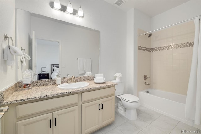 6692 S Robertsdale Way, Aurora, CO 80016 - full bathroom featuring vanity, shower / bath combination with curtain, tile patterned flooring, and ensuite bathroom