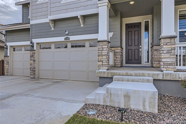 doorway to property with a garage