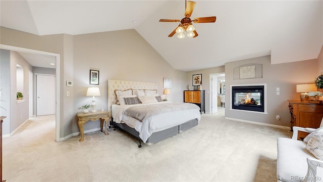 bedroom with high vaulted ceiling, light colored carpet, ceiling fan, and a multi sided fireplace