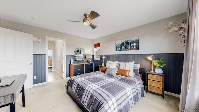 carpeted bedroom with ceiling fan and connected bathroom