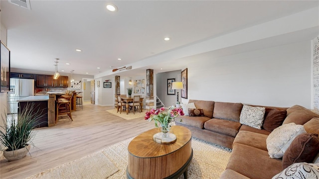 living room with light hardwood / wood-style floors