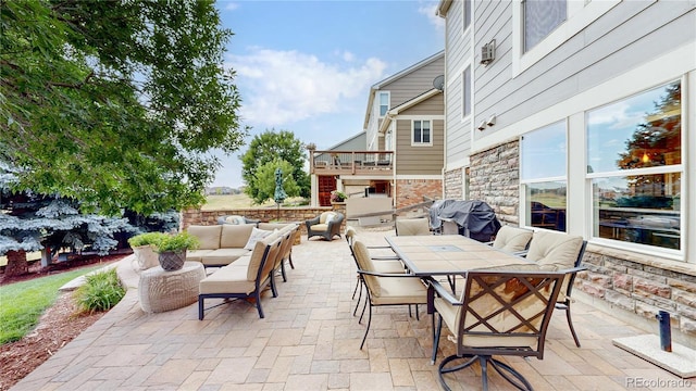 view of patio / terrace featuring a grill and an outdoor hangout area