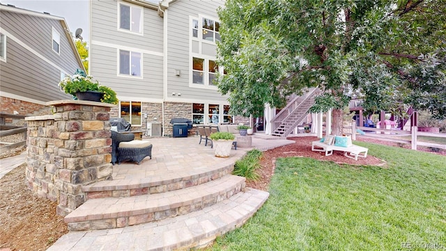 exterior space featuring a yard and a patio area