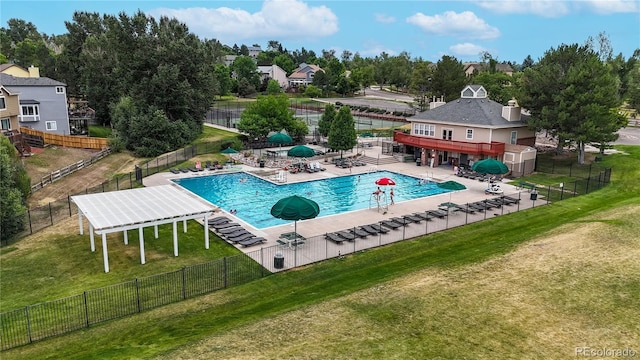 view of swimming pool with a lawn and a patio area