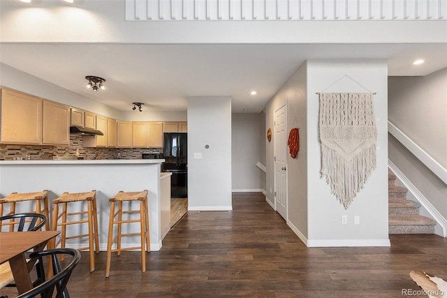 6450 W 44th Pl Unit B3, Wheat Ridge, CO 80033 - kitchen featuring under cabinet range hood, light brown cabinetry, recessed lighting, dark wood-style floors, and a peninsula