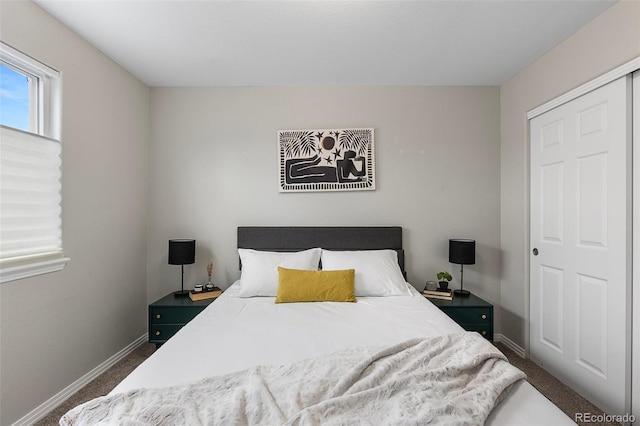 6450 W 44th Pl Unit B3, Wheat Ridge, CO 80033 - bedroom with dark colored carpet and baseboards