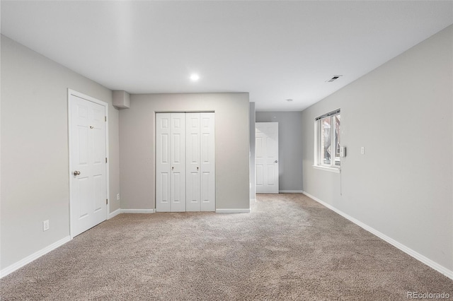 6450 W 44th Pl Unit B3, Wheat Ridge, CO 80033 - unfurnished bedroom with carpet, baseboards, a closet, and recessed lighting