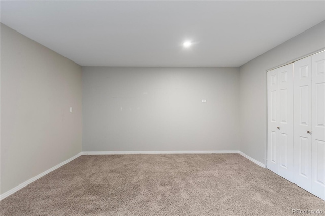 6450 W 44th Pl Unit B3, Wheat Ridge, CO 80033 - unfurnished bedroom with carpet, baseboards, and a closet