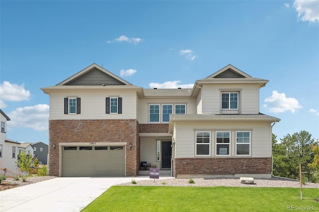 view of front of home featuring a front yard and a garage