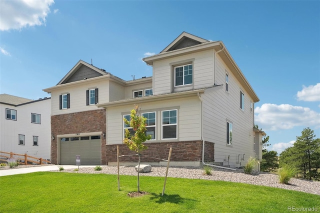 view of front facade with a front yard and a garage