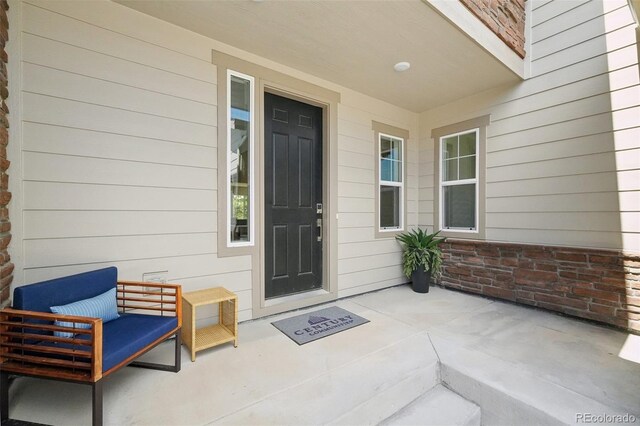 entrance to property featuring covered porch