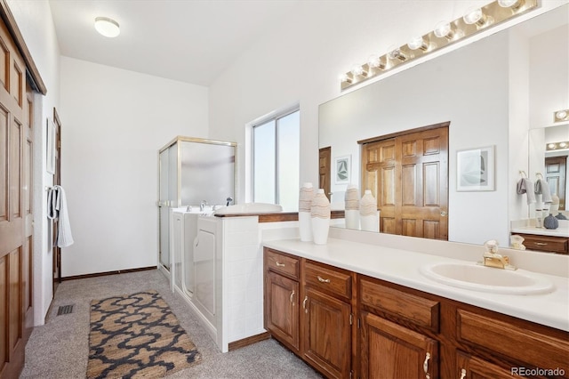 bathroom with vanity and an enclosed shower