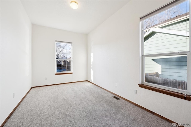 unfurnished room featuring carpet floors