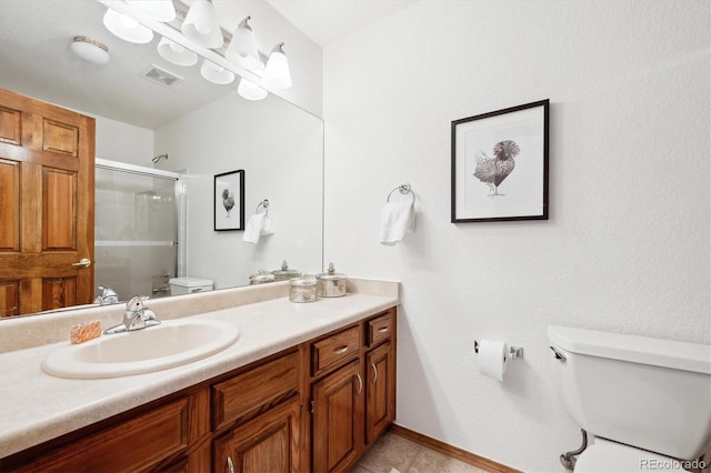 11144 Navajo St, Northglenn, CO 80234 - bathroom featuring an enclosed shower, vanity, and tile patterned floors