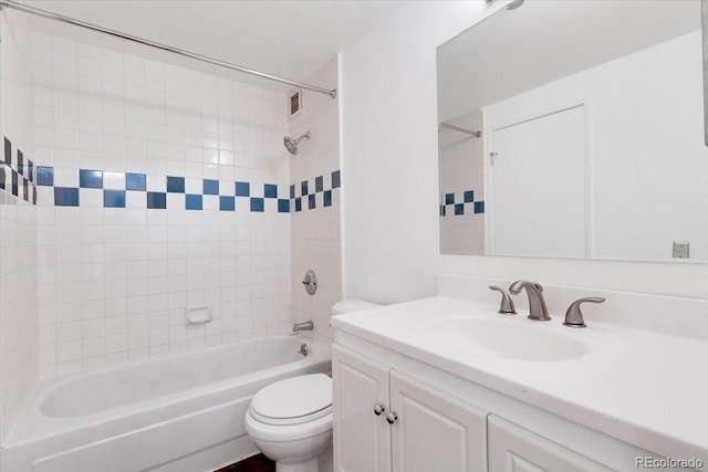 full bath with toilet, vanity, and bathing tub / shower combination