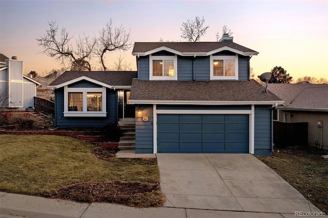 split level home with fence, an attached garage, a shingled roof, a chimney, and concrete driveway