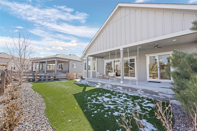 view of yard featuring a patio, fence, and a ceiling fan