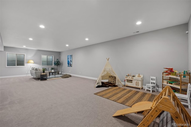 game room with carpet floors, visible vents, baseboards, and recessed lighting