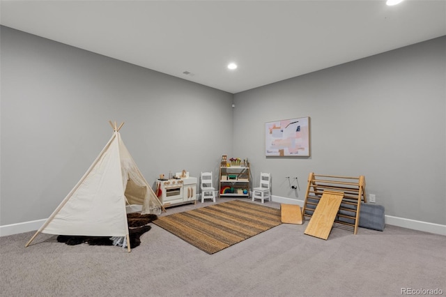 recreation room featuring carpet, baseboards, and recessed lighting