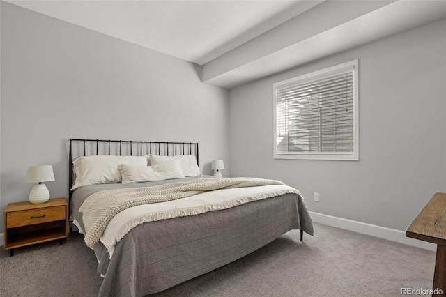 bedroom with carpet flooring and baseboards