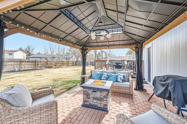 view of patio / terrace featuring grilling area, a gazebo, outdoor lounge area, outdoor dining area, and a fenced backyard