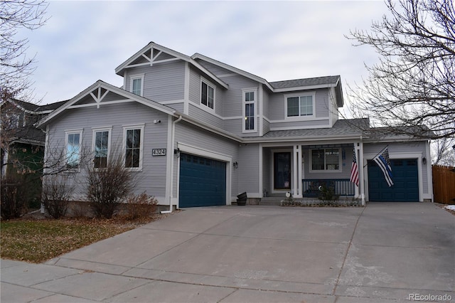 view of front of property featuring a porch and a garage