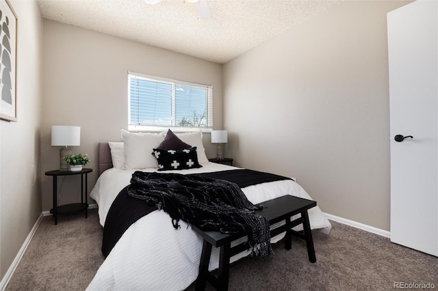 bedroom with a textured ceiling, baseboards, and carpet floors