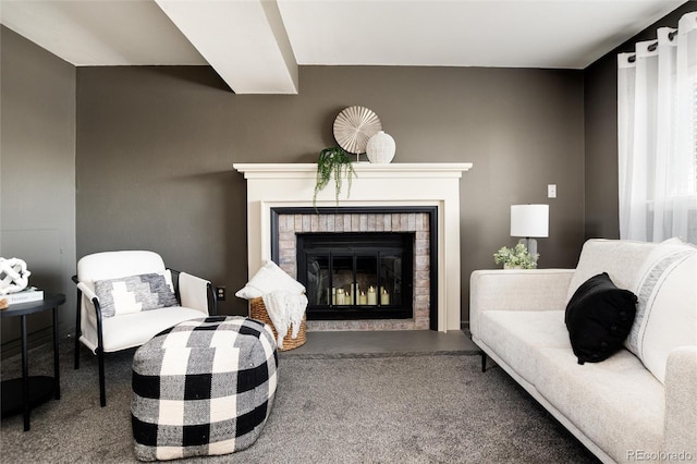 living room featuring carpet and a brick fireplace