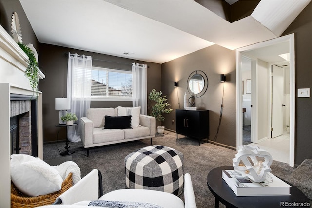 carpeted living room featuring a brick fireplace, baseboards, and visible vents