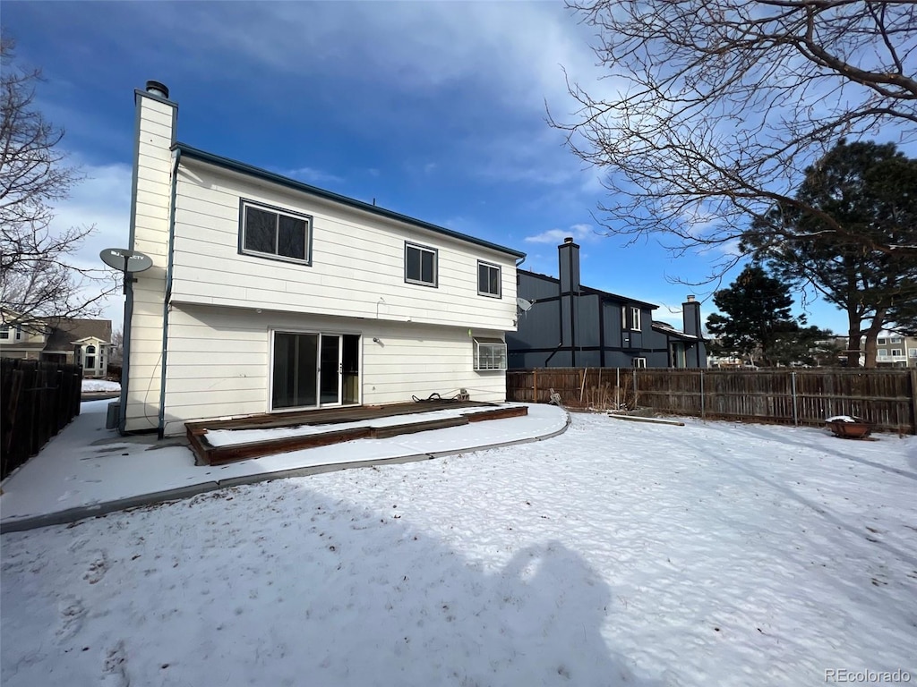 view of snow covered property