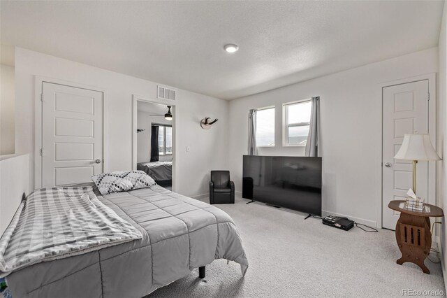 515 Bridger Ave, Fort Lupton, CO 80621 - carpeted bedroom with baseboards and visible vents