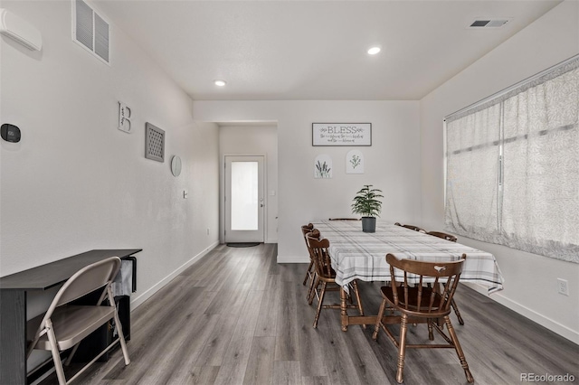 515 Bridger Ave, Fort Lupton, CO 80621 - dining room with baseboards, visible vents, and wood finished floors