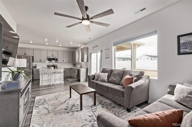 515 Bridger Ave, Fort Lupton, CO 80621 - living room with a ceiling fan, recessed lighting, visible vents, and wood finished floors