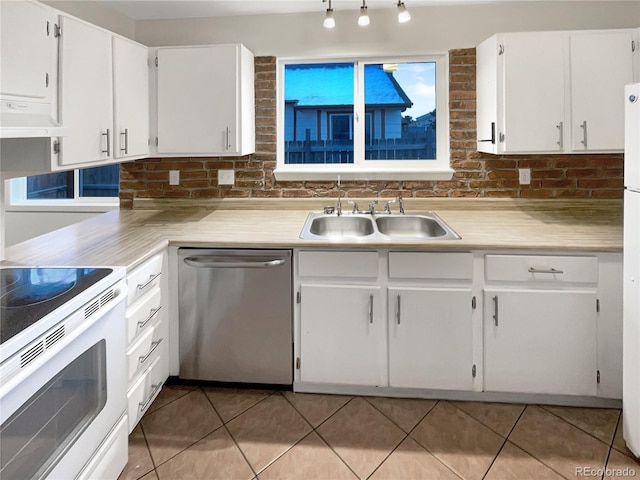 kitchen with dishwasher, white cabinetry, sink, and range hood