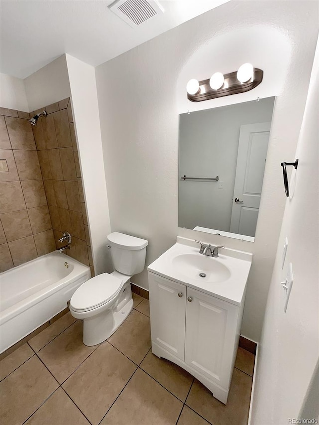 full bathroom with tile patterned floors, vanity, toilet, and tiled shower / bath