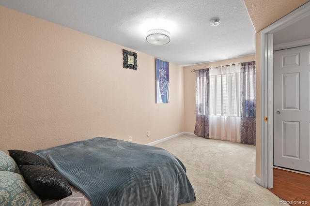 17332 E Lake Ln, Aurora, CO 80016 - bedroom with baseboards, carpet flooring, and a textured ceiling