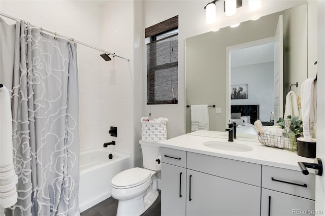 ensuite bathroom featuring toilet, ensuite bath, vanity, and shower / bathtub combination with curtain