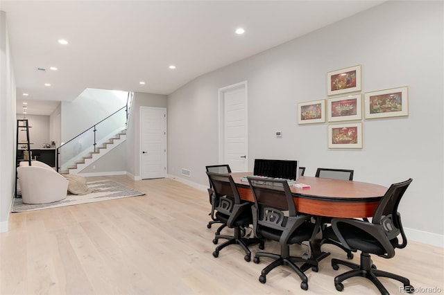 home office with light wood-style floors, recessed lighting, visible vents, and baseboards