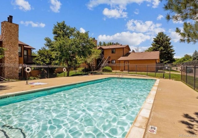 community pool featuring fence